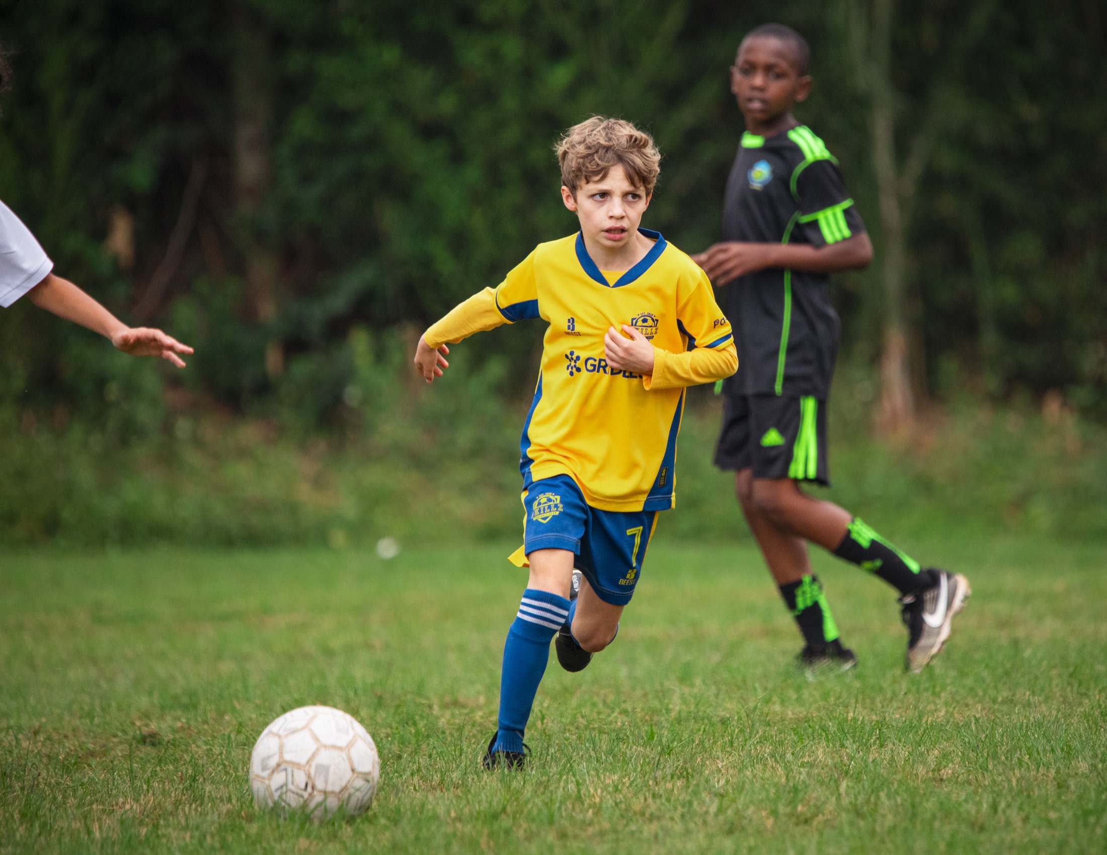 Skillz FC Academy player running with the ball